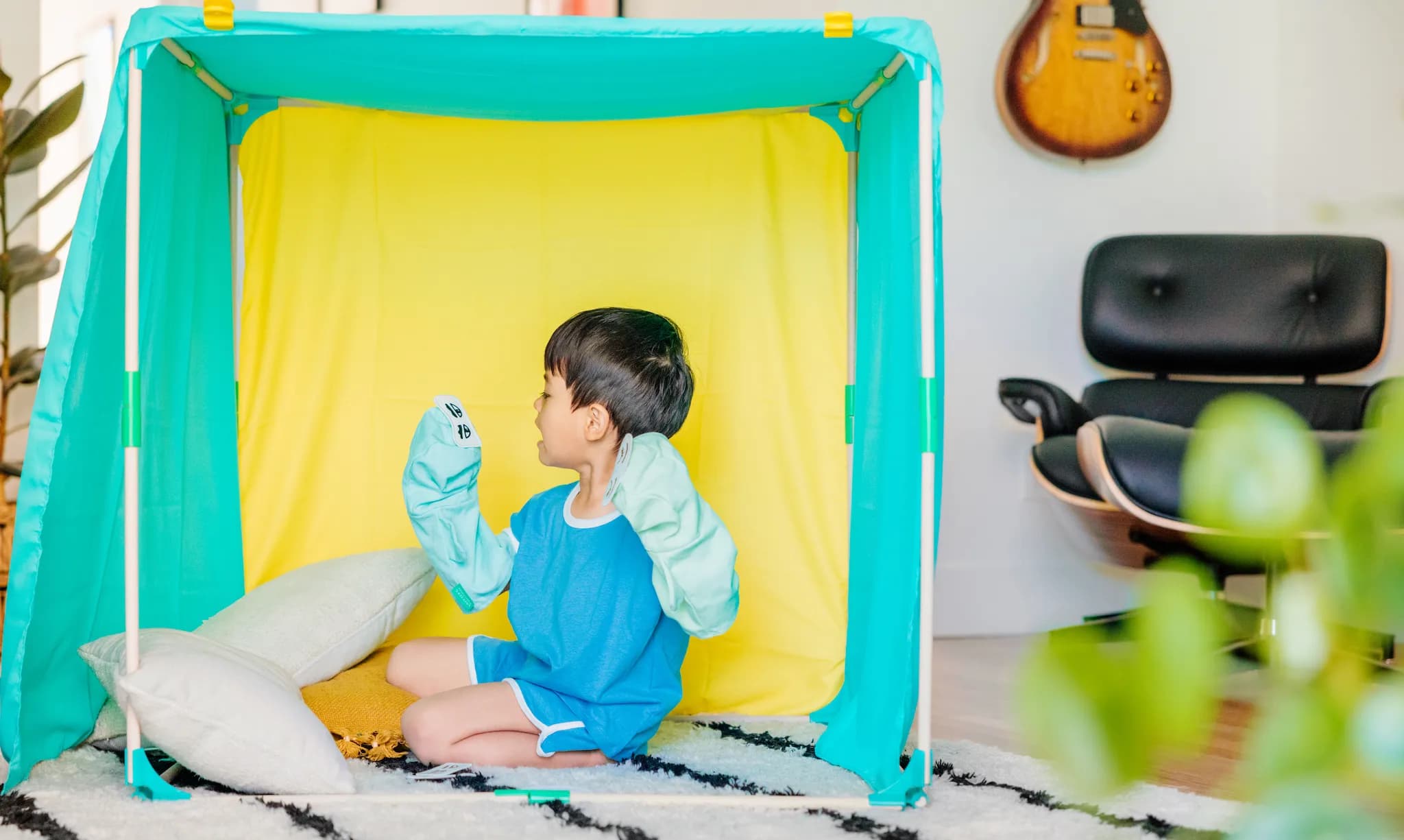 Little boy playing with Lovevery products from The Storyteller Play Kit