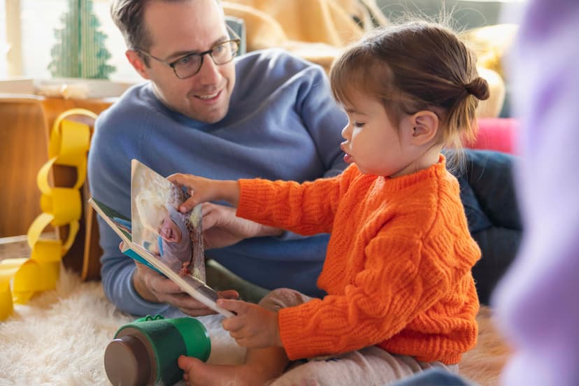 Child reading a board book from Lovevery