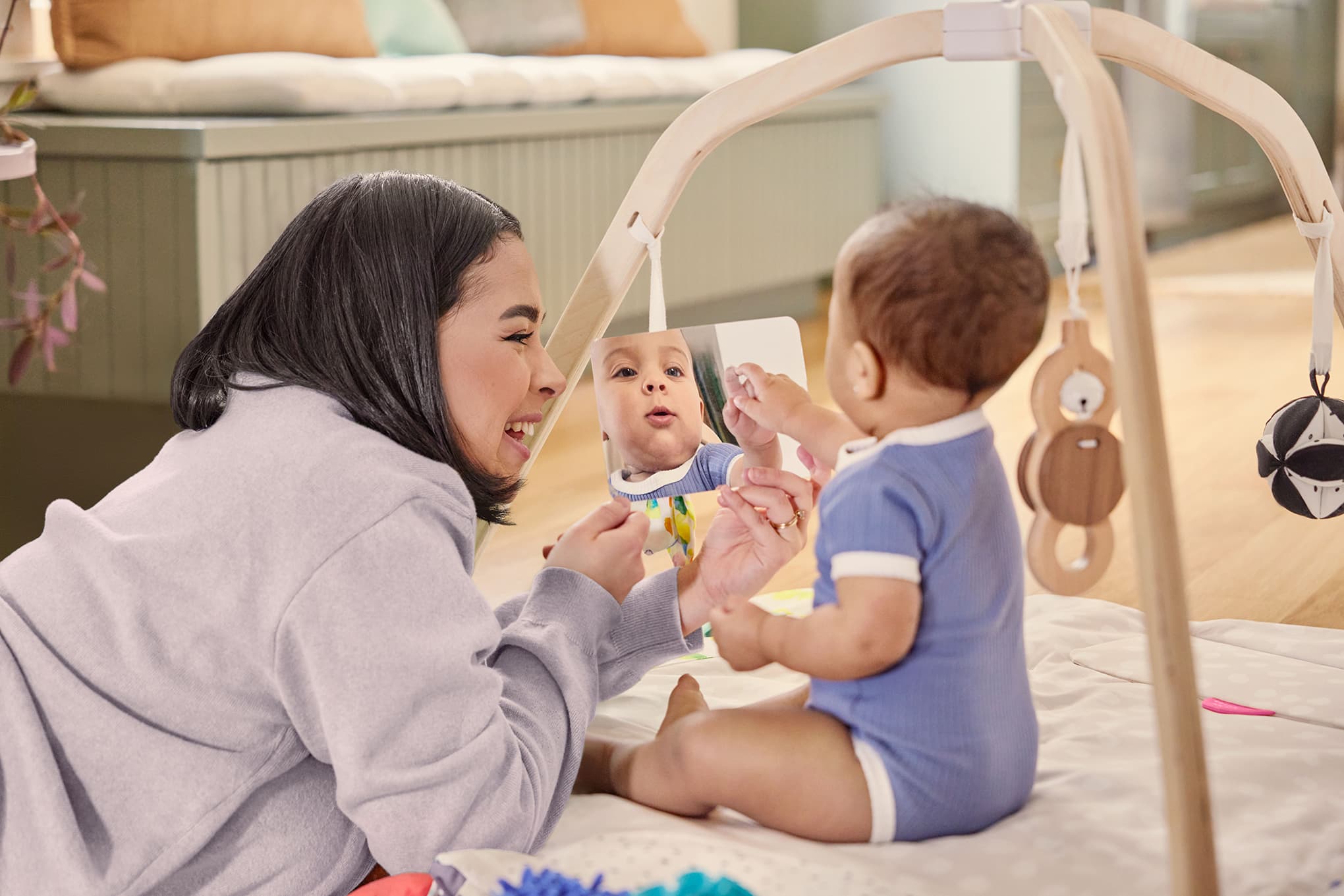 Baby and Mom playing in The Play Gym by Lovevery