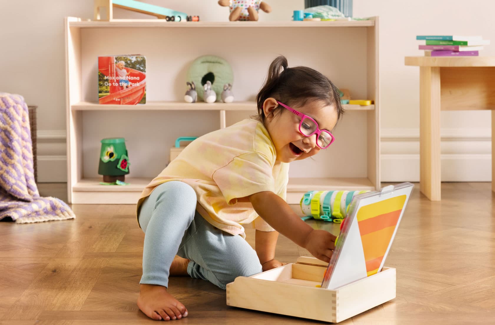 Little kid playing with playthings from Lovevery